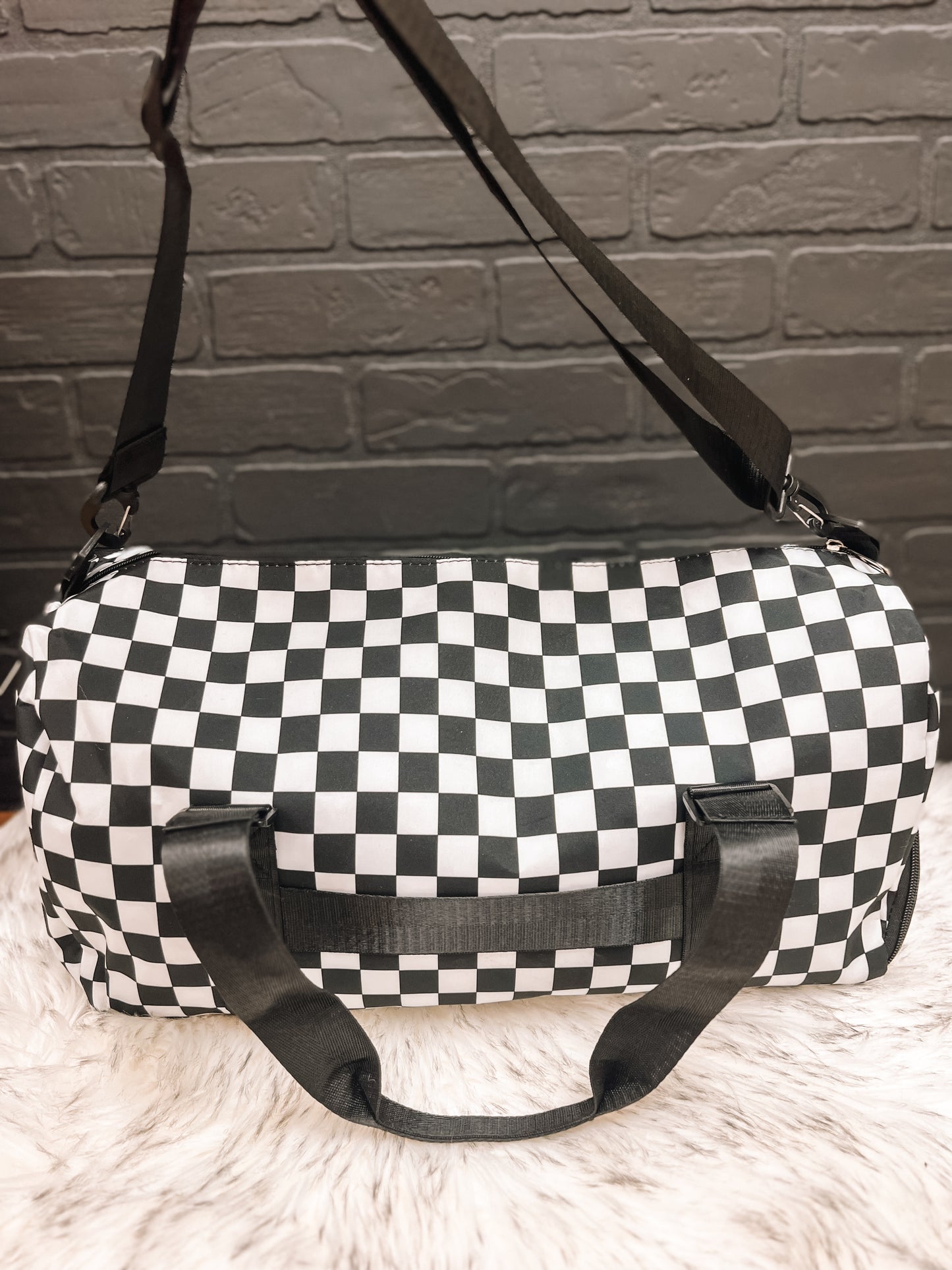 Black checkered gym duffle bag