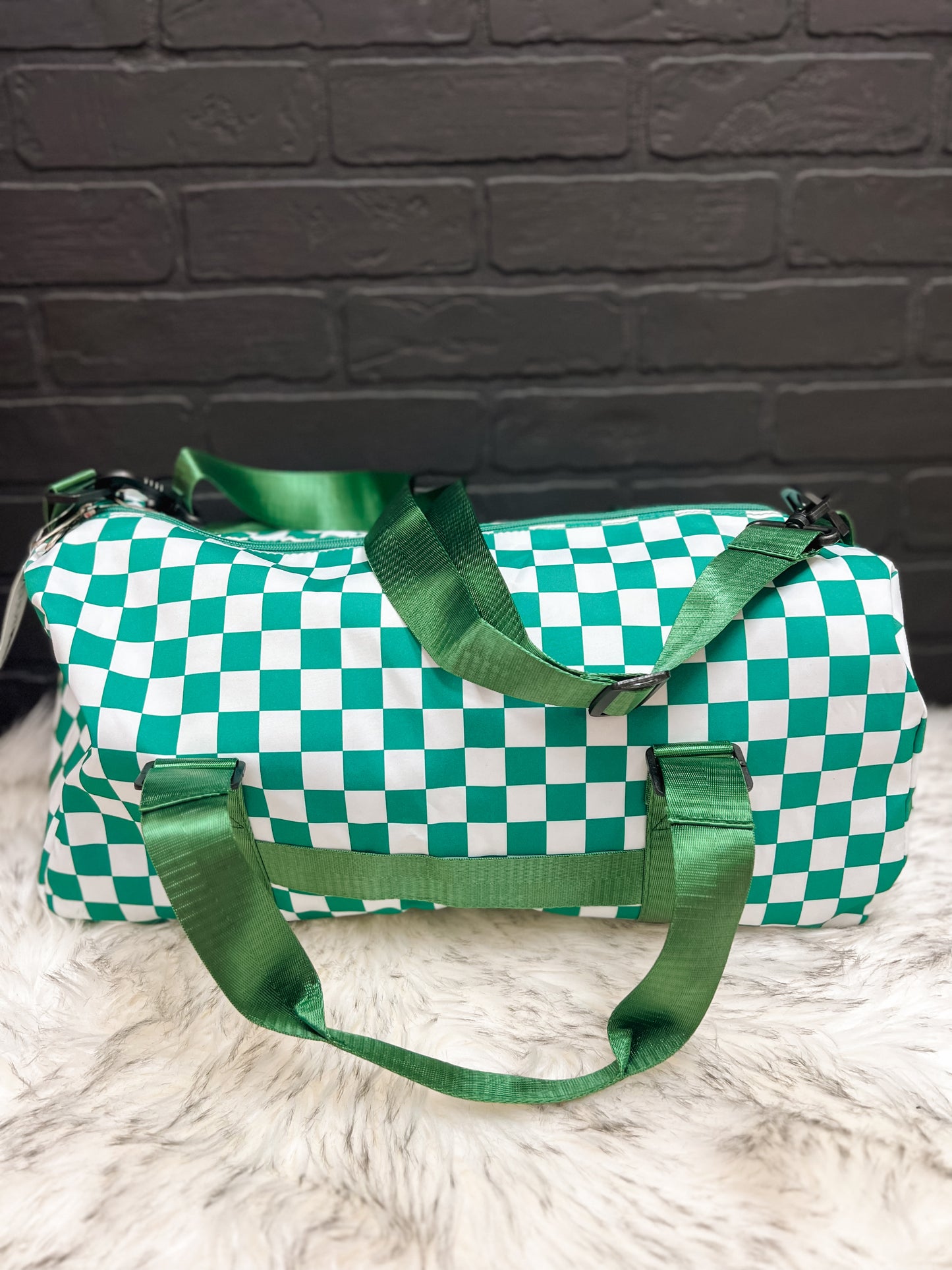 Green checkered gym duffle bag