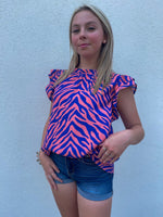 Business casual pink/zebra top with ruffle sleeves 