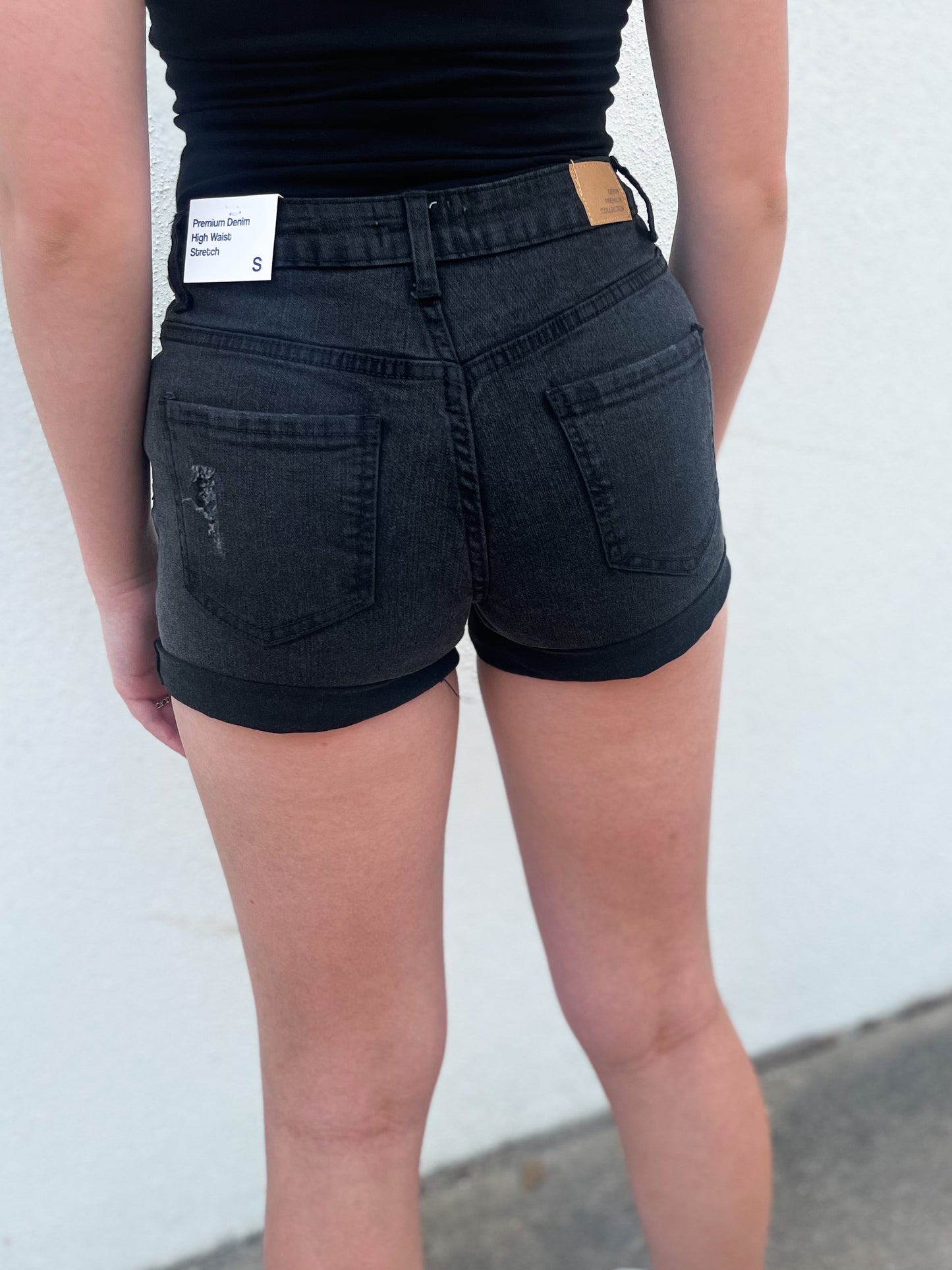 Back view of mid rise black shorts 