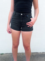 Mid rise washed black shorts with rolled hem line