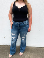 Mid rise flare distressed denim jeans, front view